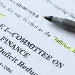 Closeup of the documents of the Inflation Reduction Act of 2022. The Unites States Senate passed the Inflation Reduction Act, the climate, tax and healthcare legislation, on Sunday, August 7, 2022.